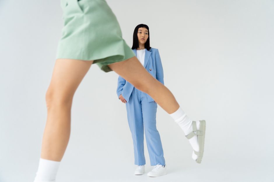 Creative studio shot highlighting modern women's fashion trends.