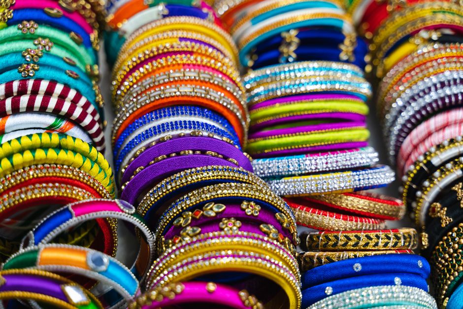 A display of colorful and vibrant bangles showcasing intricate designs and materials.