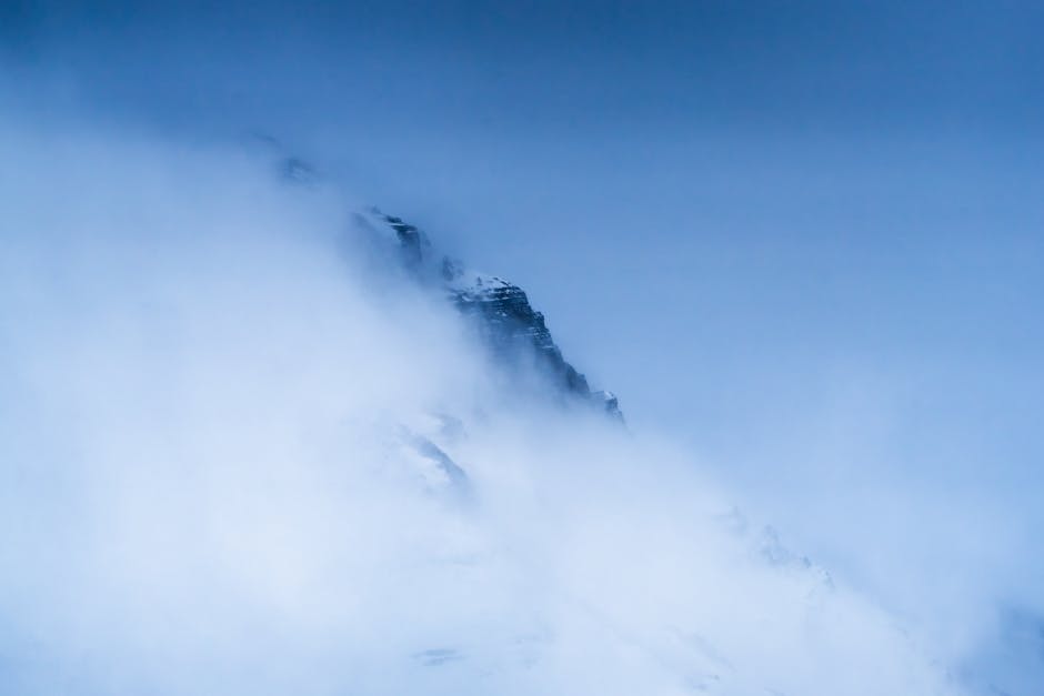 A dramatic misty mountain peak shrouded in fog in Santa Cruz, Patagonia.
